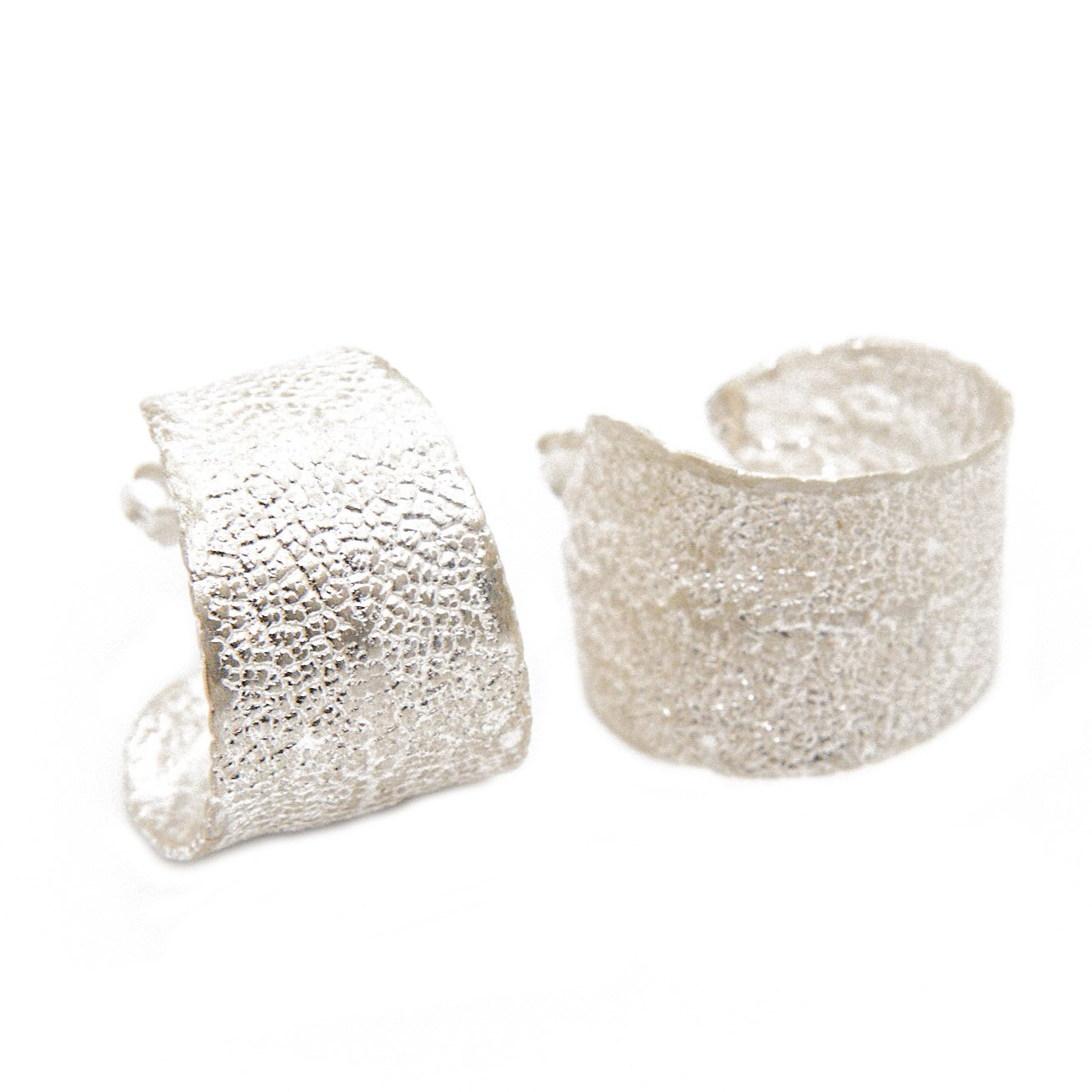 Sterling silver hoop earrings featuring real sage leaves, meticulously handcrafted in Greece, a fusion of nature's beauty and artisanal excellence.