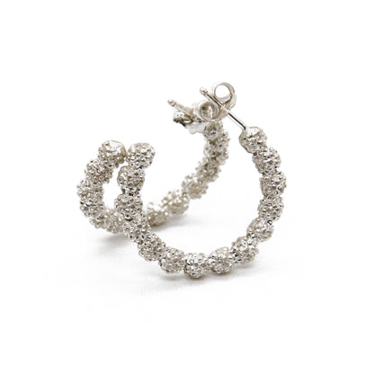 Exquisite hoop earrings crafted from high-quality sterling silver, each embellished with real acacia flowers meticulously preserved to capture the delicate beauty of their intricate blooms. These nature-inspired earrings offer a unique blend of craftsmanship and the timeless allure of natural acacia blossoms.
