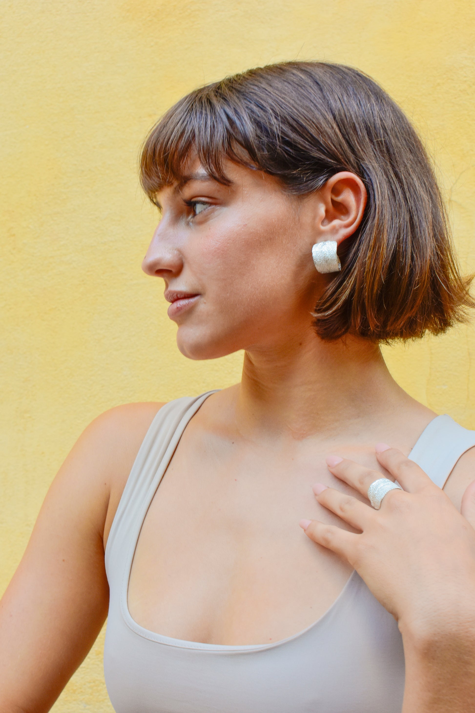 Sterling silver hoop earrings featuring real sage leaves, meticulously handcrafted in Greece, a fusion of nature's beauty and artisanal excellence.