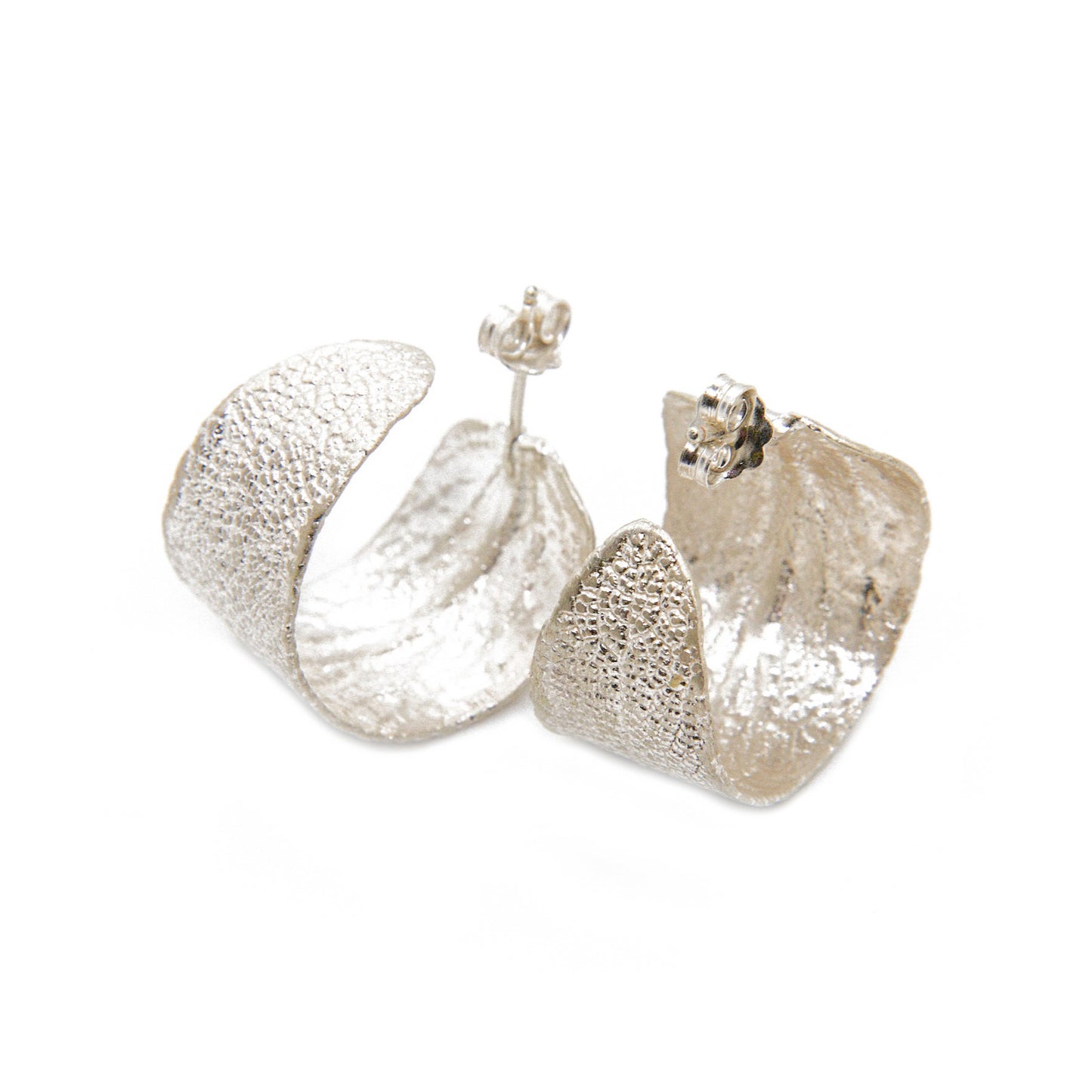 Sterling silver hoop earrings featuring real sage leaves, meticulously handcrafted in Greece, a fusion of nature's beauty and artisanal excellence.